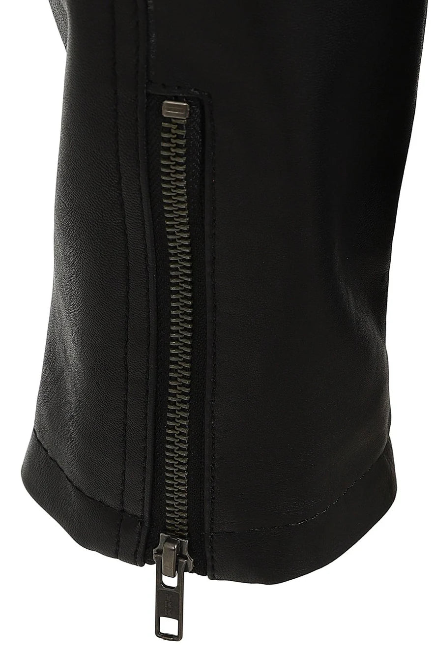 Close-up of a black jacket or pants leg with a vertical metal zipper running down the front, shown against a plain white background.