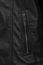 Close-up of a black leather jacket showing a vertical zippered pocket with a black metal zipper pull.